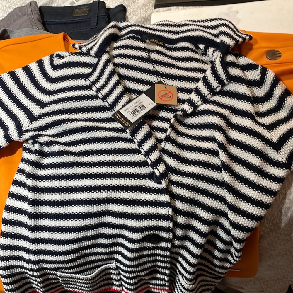 Brand New Women’s black and white striped cardigan.